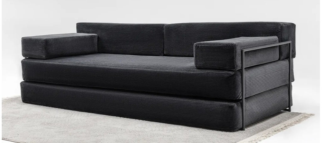 Modern modular floor couch with rust orange corduroy upholstery
