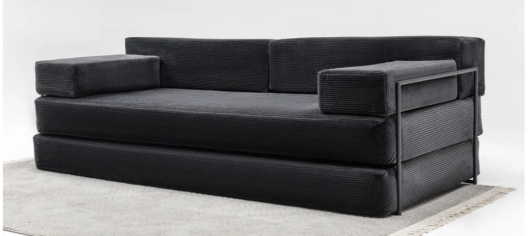 Modern modular floor couch with rust orange corduroy upholstery