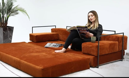 Rust orange modular corduroy floor sofa with black metal frame